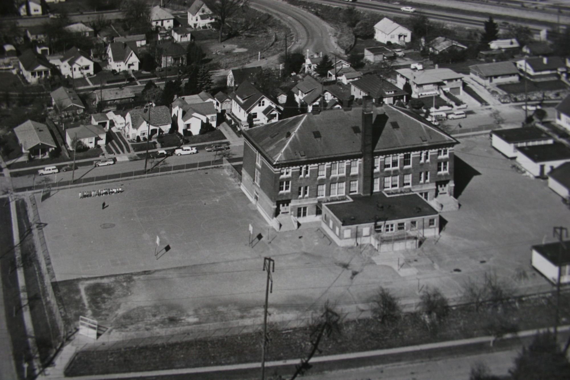 Aerial photograph of Concord School in 1965, surrounded by houses.