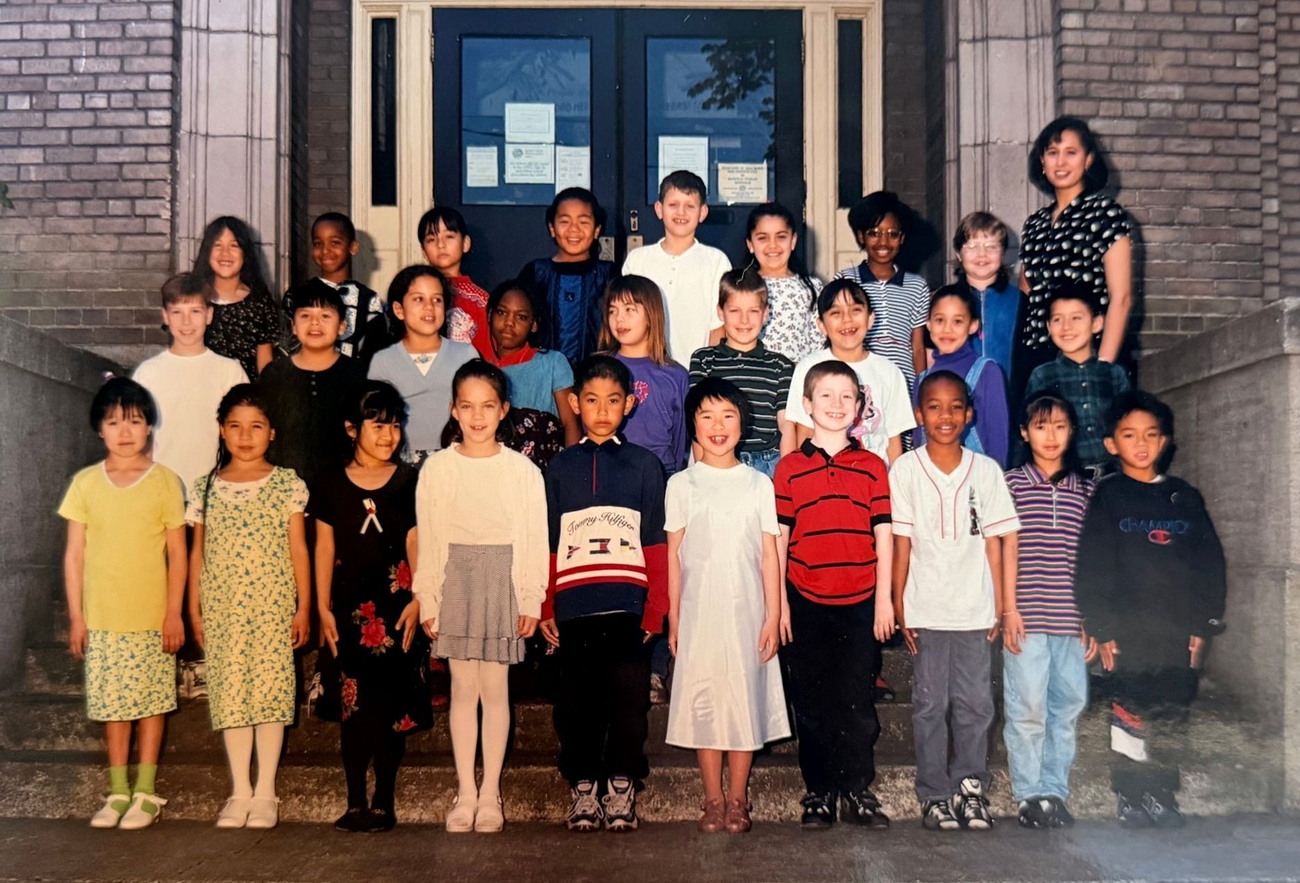 Colour class portrait, 1997: a second-grade class and their teacher on the main stair.